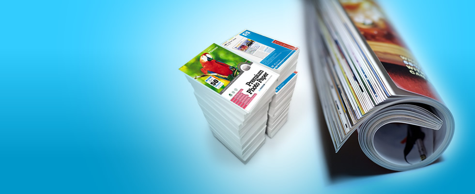 Premium photo paper and a rolled magazine produced by Universal Copy